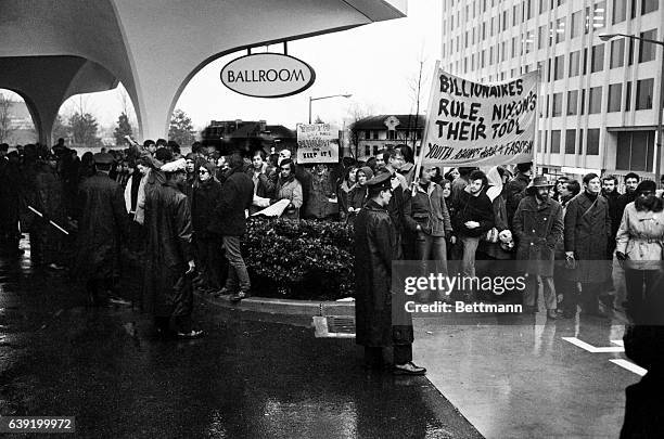 Yippies picket outside Washington Hilton Hotel where Julie and David Eisenhower, daughter and son-in-law of President-elect Richard Nixon, were...