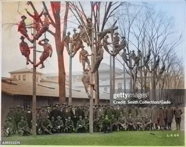 Students and instructors of a Pole-Climbing course for telephone electricians during Student Army Training Corps vocational training at the...