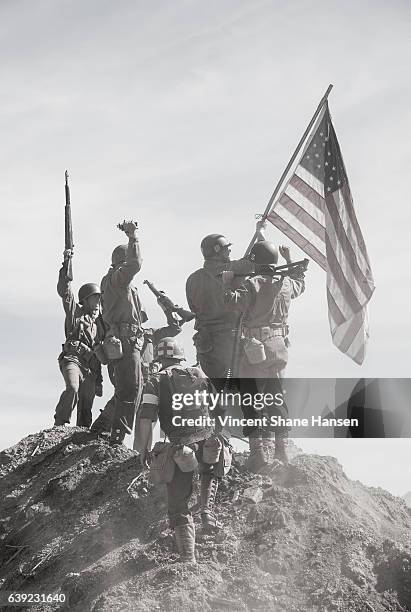 soldiers raising the us flag - usa flag black and white stock pictures, royalty-free photos & images