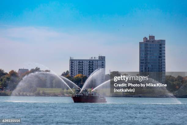 fireboat on the detroit river - detroit river ストックフォトと画像