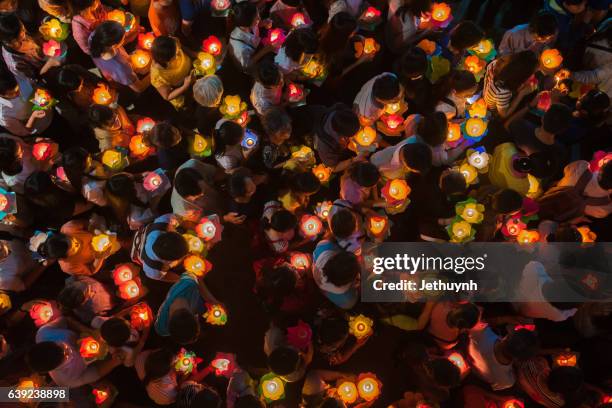 participants in a parade celebrate buddhas festival day vietnam - lantern festival celebrates buddhas birthday ストックフォトと画像