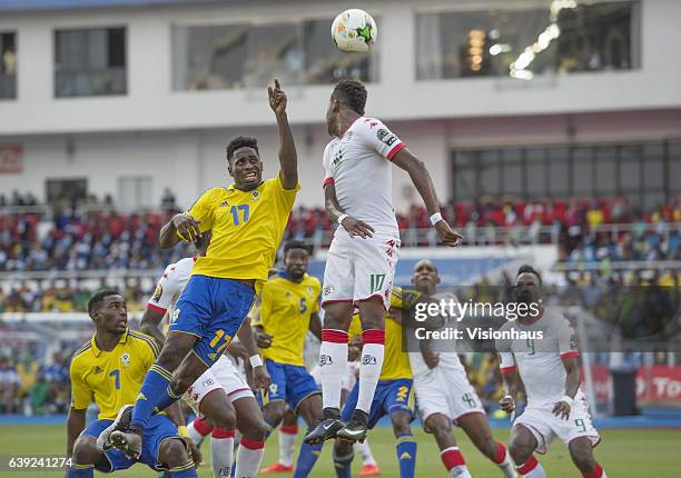 Sibiri Traore of Burkina Faso clear the ball from Andre Biyogo Poko of Gabon during the Group A match between Gabon and Burkina Faso at Stade de...