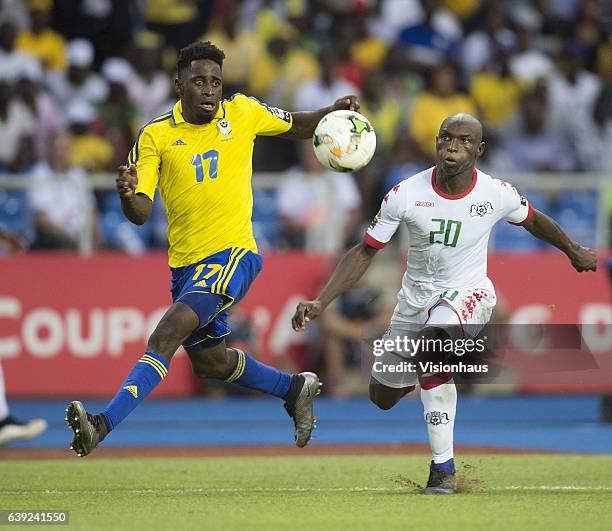 Andre Biyogo Poko of Gabon and Yacouba Coulibaly of Burkina Faso during the Group A match between Gabon and Burkina Faso at Stade de L'Amitie on...