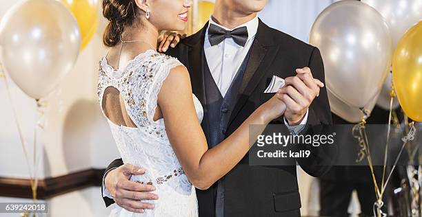 cropped teenage couple at prom dancing - prom imagens e fotografias de stock