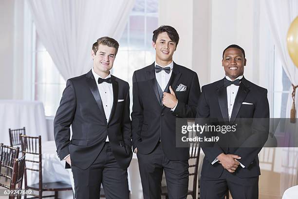 three young men wearing tuxedos - prom stockfoto's en -beelden