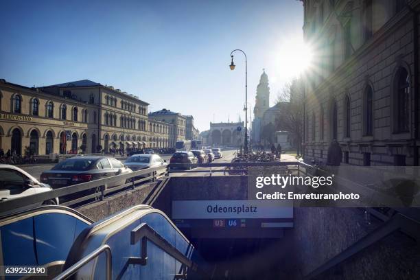 odeonplatz subway station and theatiner church towers at the background ,munich. - munich street stock pictures, royalty-free photos & images