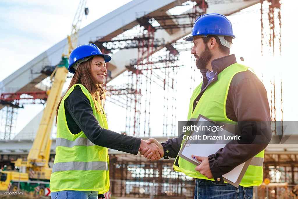 Engineers handshake after successful day