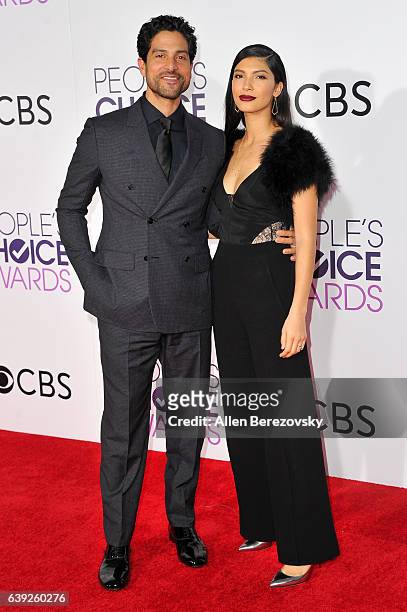 Actor Adam Rodriguez and Grace Gail arrive at People's Choice Awards 2017 at Microsoft Theater on January 18, 2017 in Los Angeles, California.