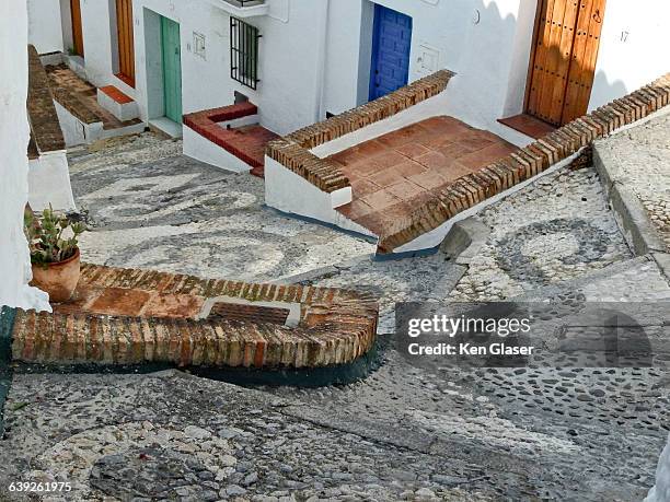 frigilliana doorways and stone street - frigiliana stock pictures, royalty-free photos & images