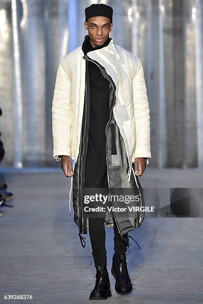 Model walks the runway during the Boris Bidjan Saberi Menswear Fall/Winter 2017-2018 show as part of Paris Fashion Week on January 19, 2017 in Paris,...