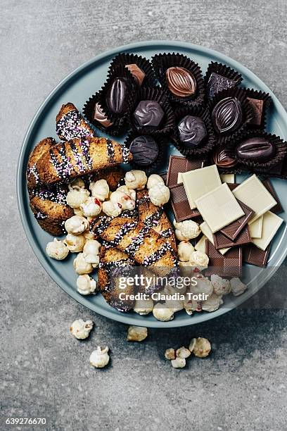 platter of sweets (chocolate bites, gourmet popcorn and biscotti) - biscotti stock pictures, royalty-free photos & images