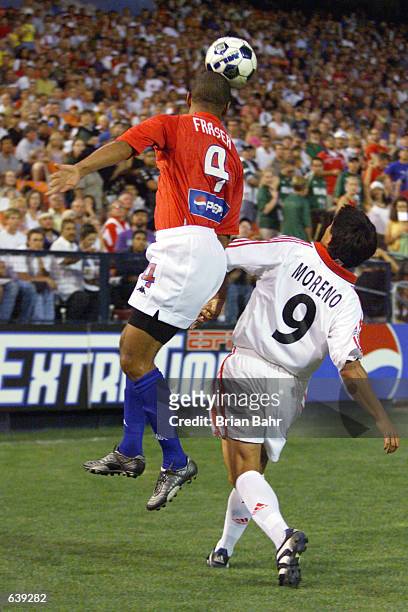 Robin Fraser of the Colorado Rapids heads the ball over the defense of the D.C. United at Mile High Stadium in Denver, Colorado. The Rapids won 3-1....