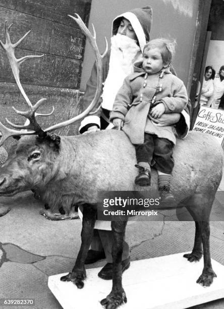 Billy Cadell met Santa and Rudolph the reindeer in Market Street, Edinburgh. Santa and Rudolph were on their way to Edinburgh's Fruit Market Gallery...