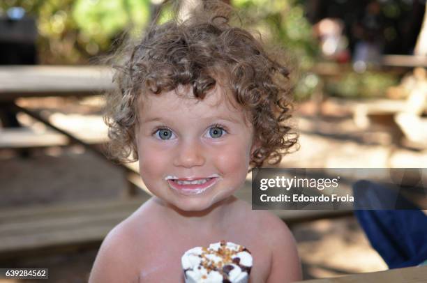 young girl eating ice cream cone. - hot dirty girl stock pictures, royalty-free photos & images