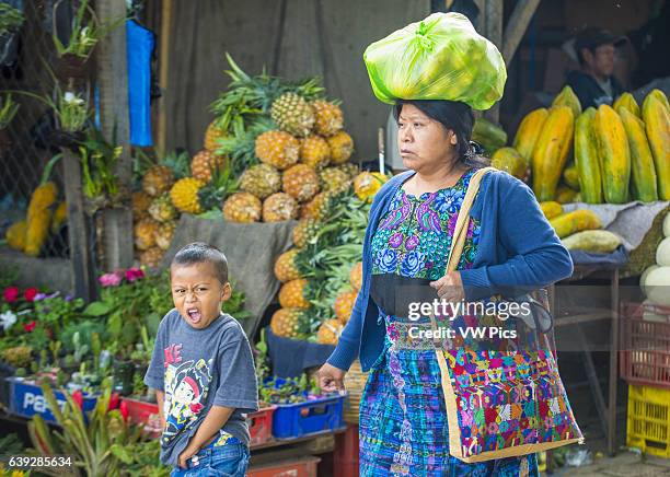 Guatemalan mother and son at the Chichicastenango Market. This native market is the most colorful in Central America.