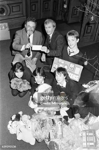 Royds Hall High School head Peter Clarkson presenting ø40 cheque to NSPCC for their Christmas toy appeal. 19th December 1985.Royds Hall High School...