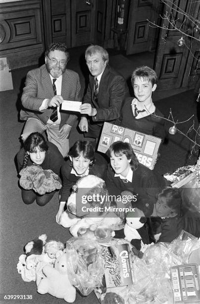 Royds Hall High School head Peter Clarkson presenting ø40 cheque to NSPCC for their Christmas toy appeal. 19th December 1985.Royds Hall High School...