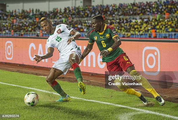 Of Guinea Bissau and OYONGO BITOLO AMBROISE of Cameroon during the Group A match between Cameroon and Guinea Bissau at Stade de L'Amitie on January...