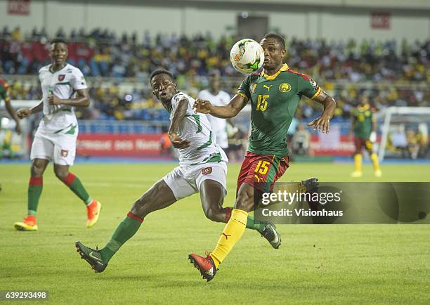 Of Cameroon and FRANCISCO SILVA JUNIOR of Guinea Bissau during the Group A match between Cameroon and Guinea Bissau at Stade de L'Amitie on January...