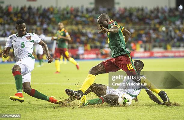 Of Cameroon and TOMAS DABO and RUDNILSON SILVA of Guinea Bissau during the Group A match between Cameroon and Guinea Bissau at Stade de L'Amitie on...
