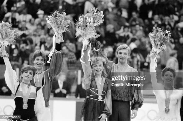 Winter Olympics, 14th February 1984. Figure skating, Medal Ceremony, Zetra Stadium, Sarajevo, Yugoslavia. Jayne Torvill and Christopher Dean racked...