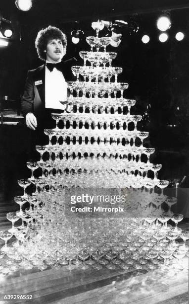 The world champagne fountain goes pop at Rotters night club in Liverpool, with more than 700 glasses topped up with 14 gallons of champagne easily...