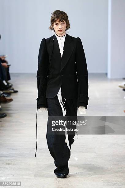 Model walks the runway during the Ann Demeulemeester designed by Sébastien Meunier Menswear Fall/Winter 2017-2018 show as part of Paris Fashion Week...