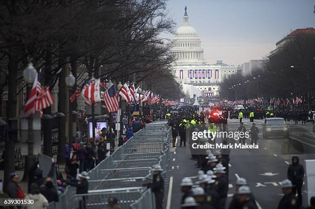 Police line the streets in front of the Trump International Hotel, with the Capitol Building in the distance, before the inauguration of Donald Trump...