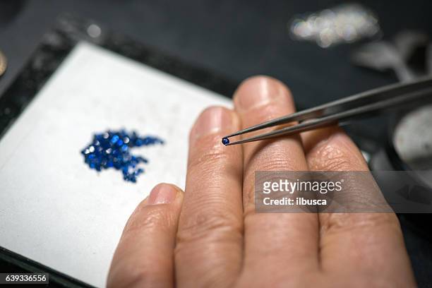 professional gemstone settings jewellery craft laboratory: selecting sapphire - sapphire stock pictures, royalty-free photos & images