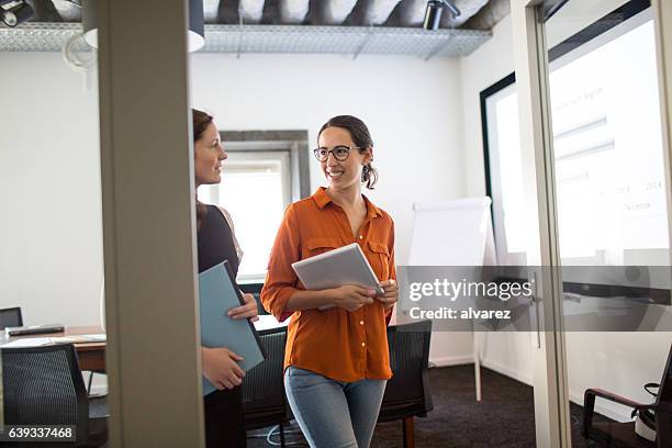 talking business during an office walk - business casual walking stock pictures, royalty-free photos & images