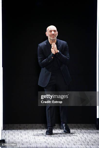 Designer Richard Nicoll walks the runway during the Cerruti designed by Richard Nicoll Menswear Fall/Winter 2017-2018 show as part of Paris Fashion...