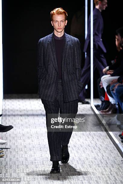 Model walks the runway during the Cerruti designed by Richard Nicoll Menswear Fall/Winter 2017-2018 show as part of Paris Fashion Week on January 20,...