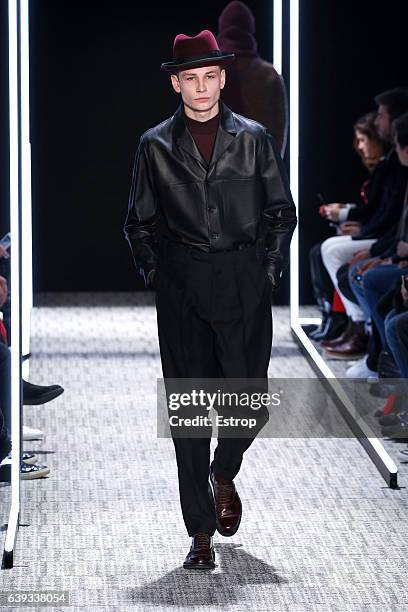 Model walks the runway during the Cerruti designed by Richard Nicoll Menswear Fall/Winter 2017-2018 show as part of Paris Fashion Week on January 20,...