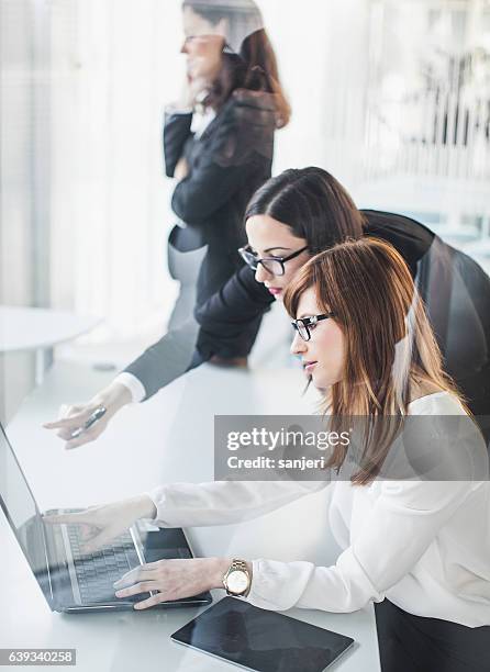 businesswomen working in the office - a meeting place for the european digital industry stock pictures, royalty-free photos & images