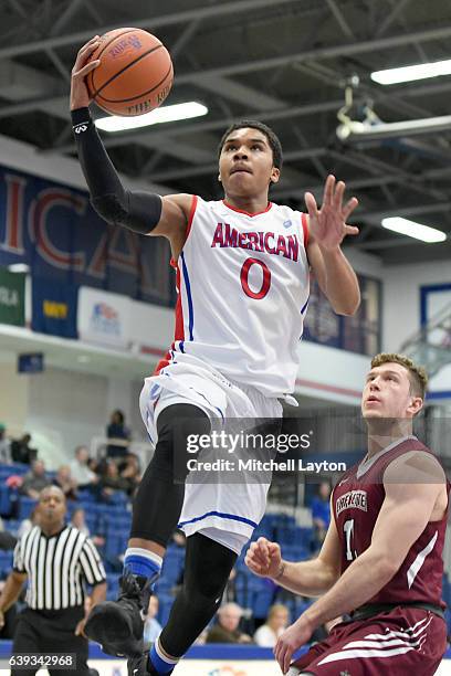 Sa'eed Nelson of the American University Eagles drives to the basket during a college basketball game against the Lafayette Leopards at Bender Arena...