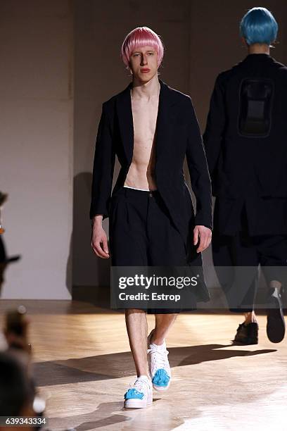 Model walks the runway during the Comme Des Garcons Homme Plus Menswear Fall/Winter 2017-2018 show as part of Paris Fashion Week on January 20, 2017...