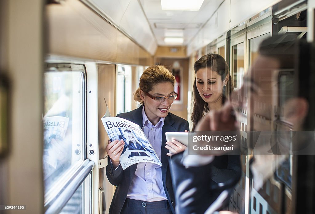 Business People on a Train