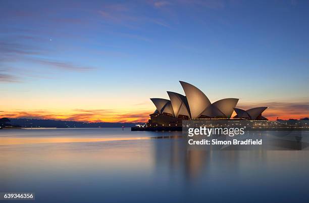 dawn breaks over the sydney opera house - sydney stock pictures, royalty-free photos & images