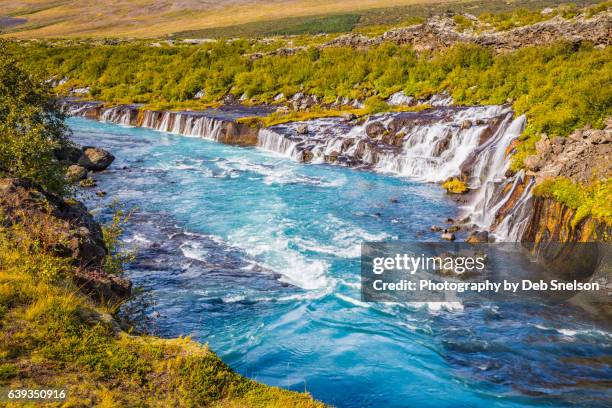 hraunfossar falls and the river hvita - hraunfossar stock pictures, royalty-free photos & images