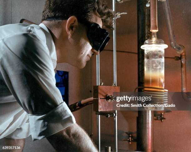 Induction heating using high frequency currents purifies refractory metals in a vaccuum at high temperatures, 1967. Image courtesy US Department of...