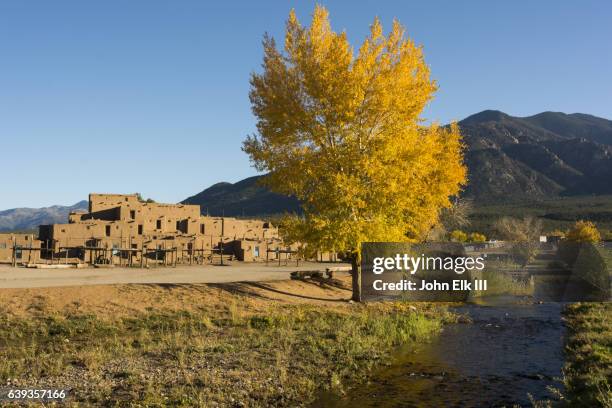 taos pueblo with rio pueblo de taos - taos fotografías e imágenes de stock