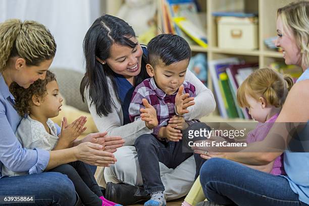 clapping and singing sonds - library kids stock pictures, royalty-free photos & images
