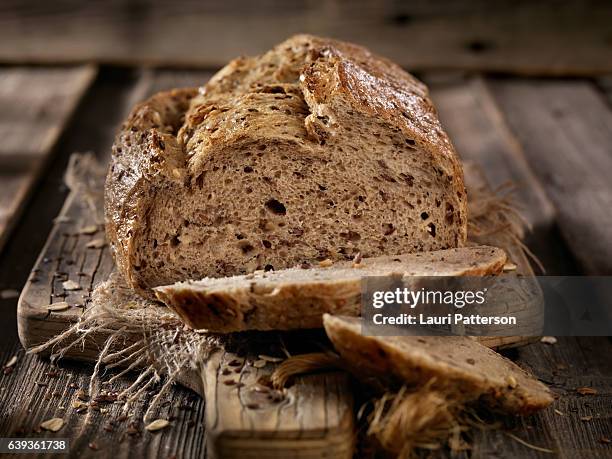 9 grain artisan bread loaf - homemade loaf of bread stock pictures, royalty-free photos & images