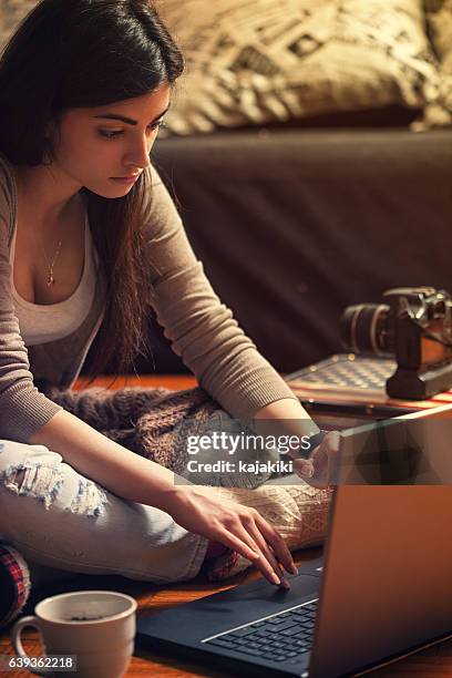 woman using laptop with camera and phone - creative writer stock pictures, royalty-free photos & images