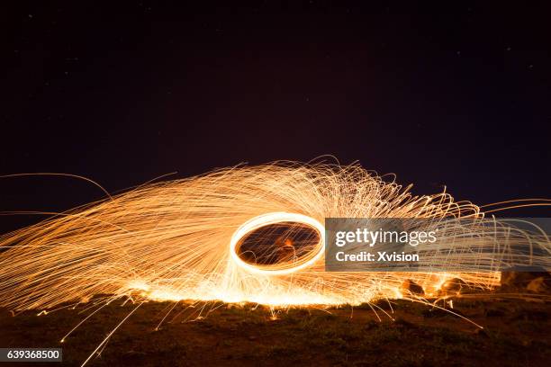 creative light painting by burning steelwool - burning steel wool firework stock pictures, royalty-free photos & images