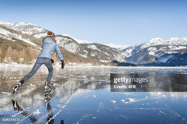 ice skating, frozen lake grundlsee, austria - figure skating woman stock pictures, royalty-free photos & images