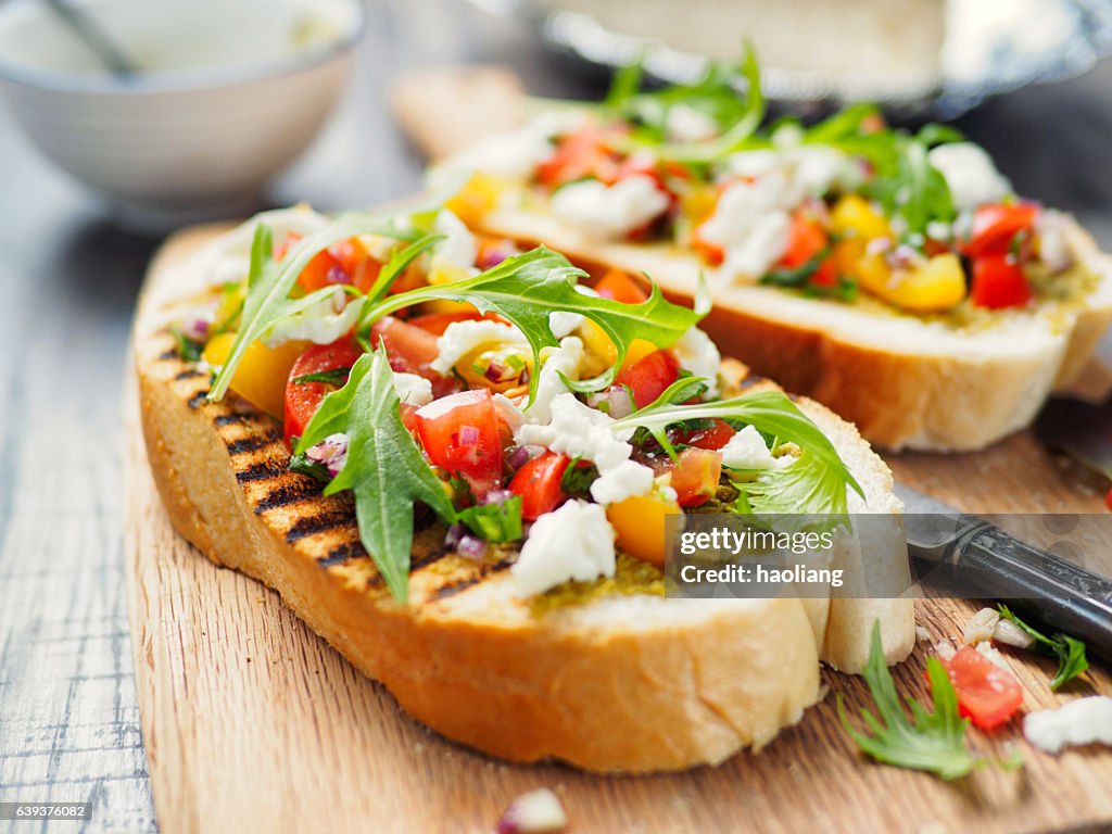 Bruschetta with tomato and rocket