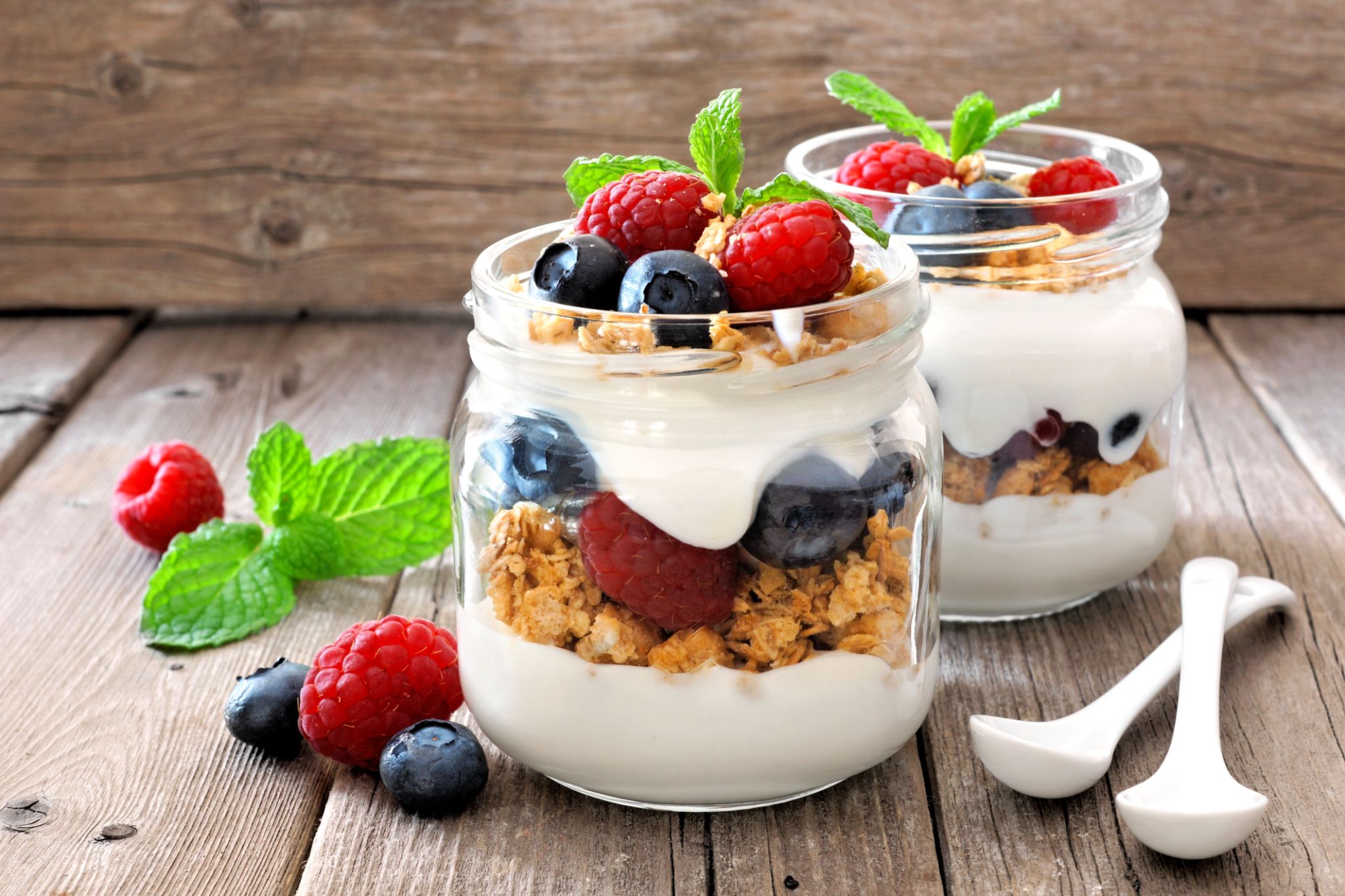 Blueberry and raspberry parfait in two mason jars Blueberry and raspberry parfait in two mason jars