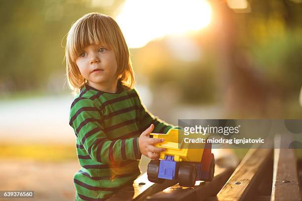 little boy and toy - toy truck stock pictures, royalty-free photos & images