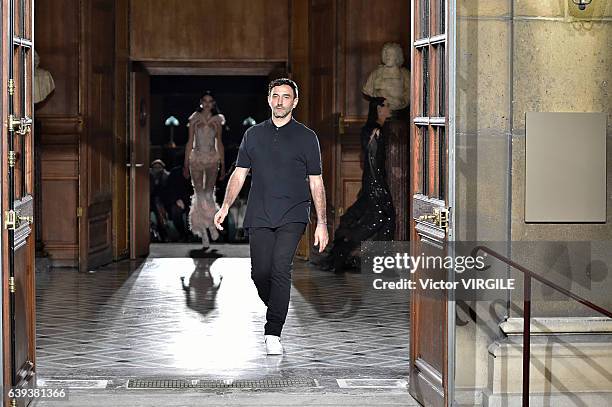 Fashion designer Riccardo Tisci walks the runway during the Givenchy Menswear Fall/Winter 2017-2018 show as part of Paris Fashion Week on January 20,...